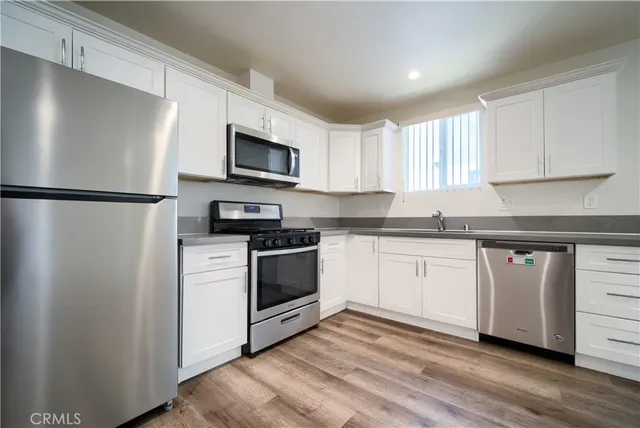 a bed room with a bed and a television