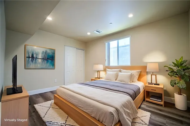 a bathroom with a granite countertop sink toilet a mirror and shower