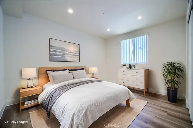 a bathroom with a granite countertop sink toilet a mirror and shower