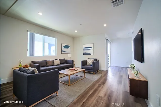 a kitchen with a refrigerator and a stove top oven