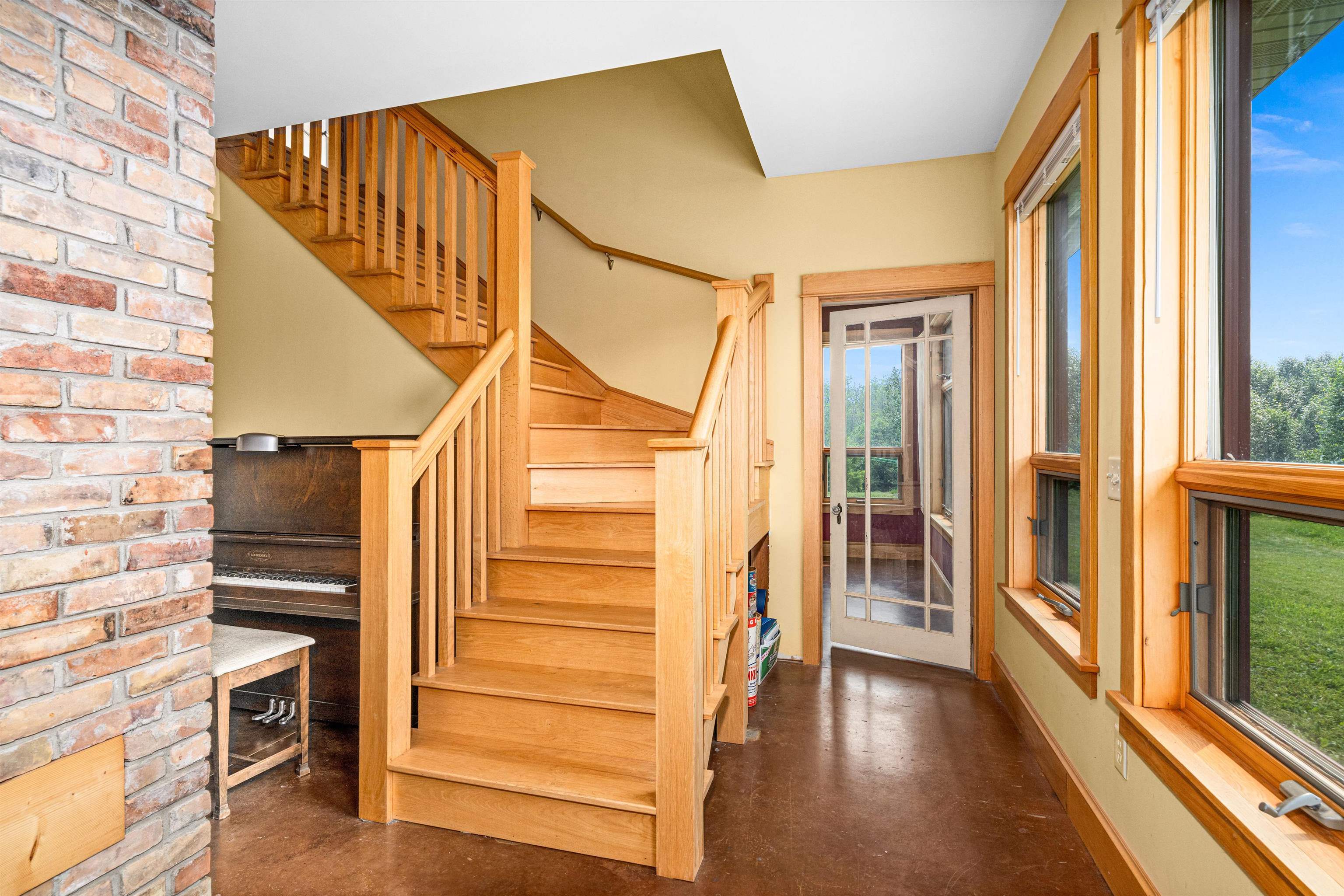 374 Nelson Road Cloquet, MN 55720 - Photo 11 of 33 Stairs with finished concrete flooring and baseboards
