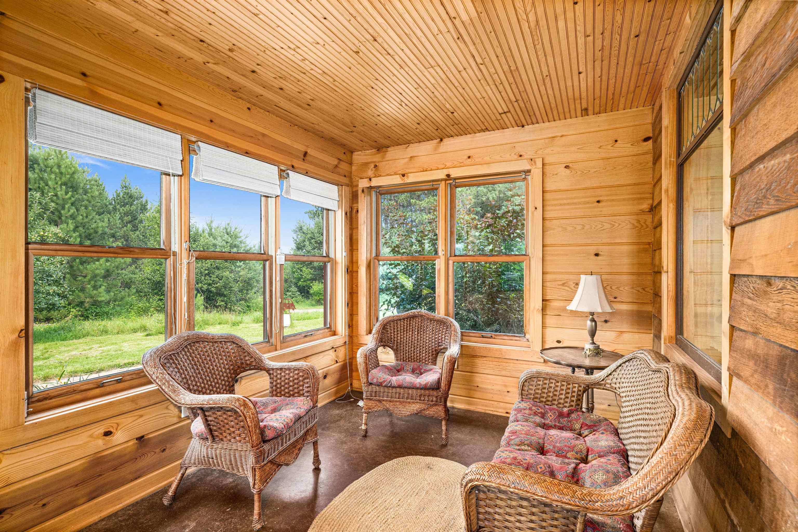 374 Nelson Road Cloquet, MN 55720 - Photo 13 of 33 Sunroom with wooden walls, wood ceiling, and concrete floors