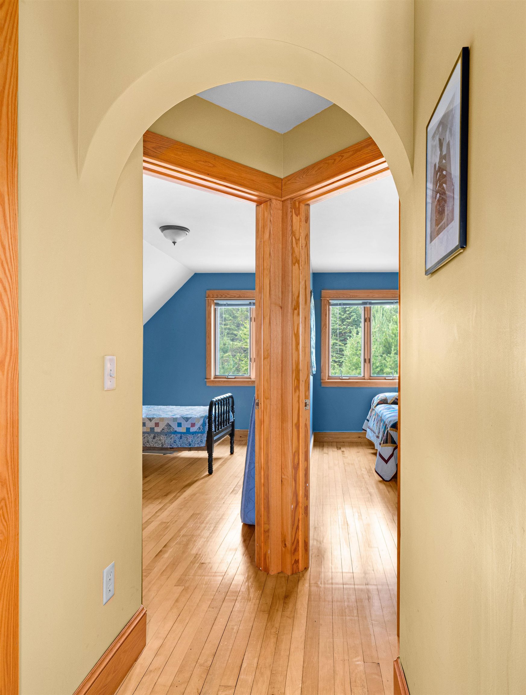 374 Nelson Road Cloquet, MN 55720 - Photo 24 of 33 Corridor with arched walkways and hardwood / wood-style floors