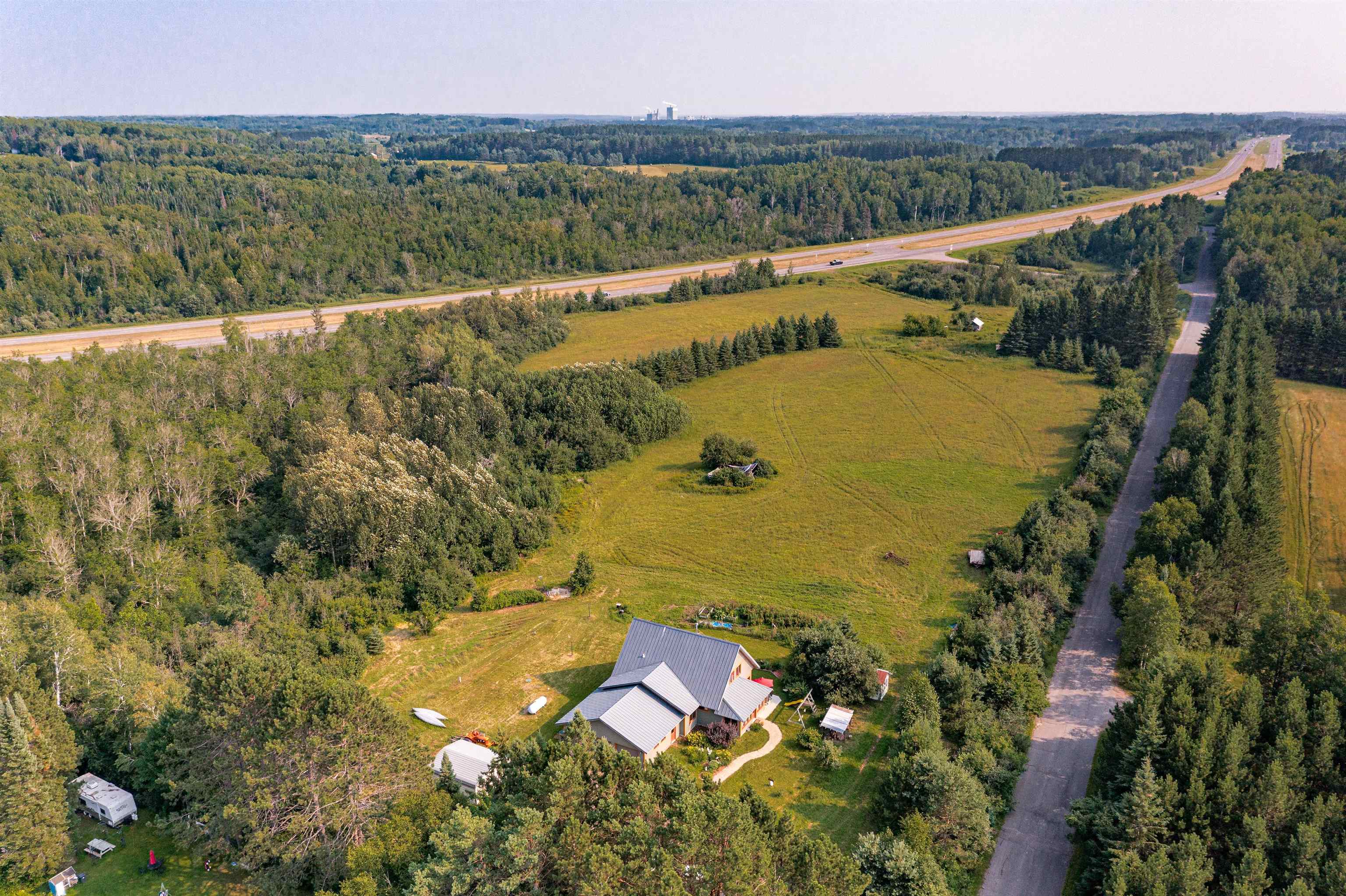 374 Nelson Road Cloquet, MN 55720 - Photo 29 of 33 Aerial overview of property's location with rural landscape and a heavily wooded area