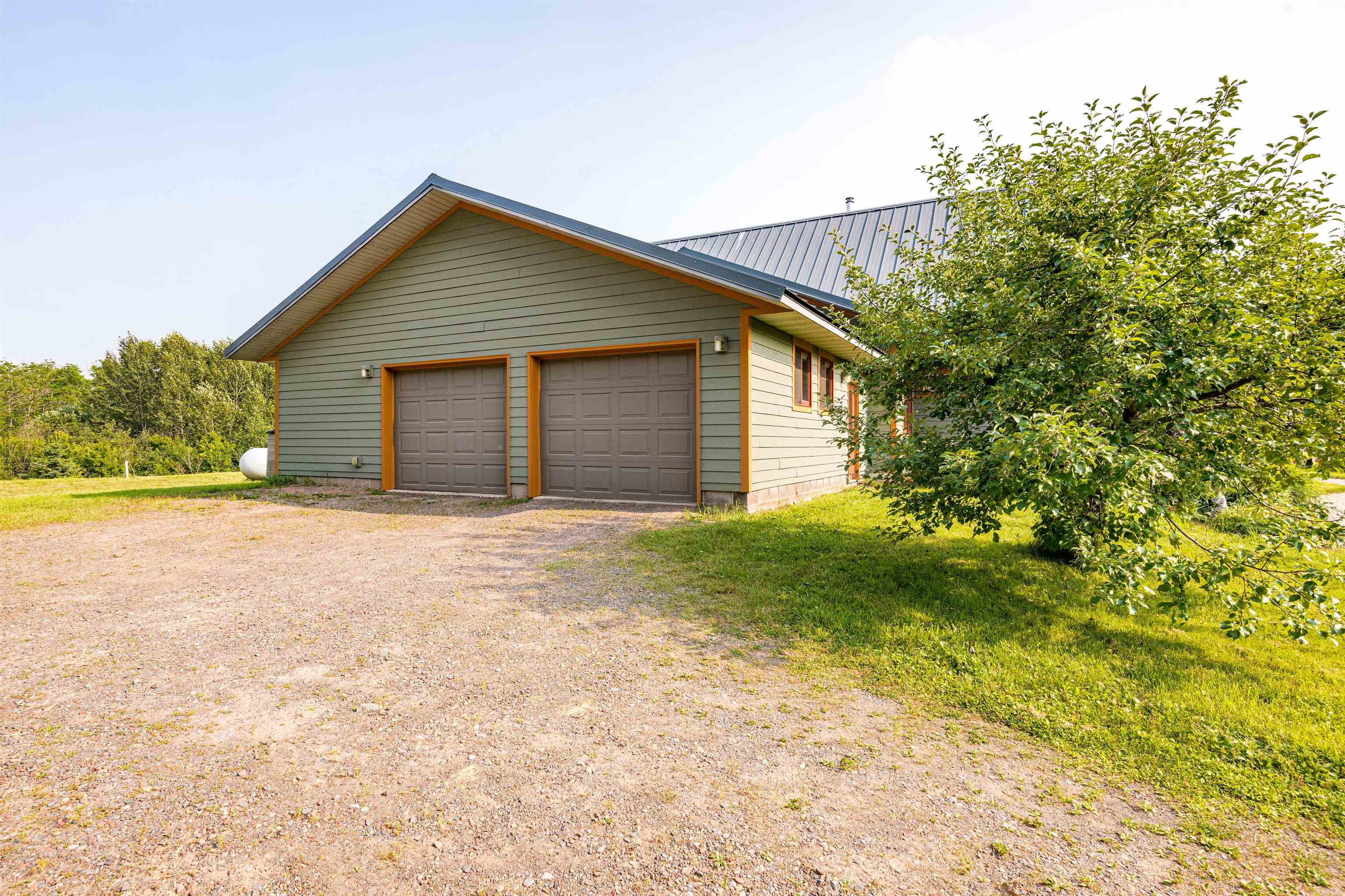 374 Nelson Road Cloquet, MN 55720 - Photo 5 of 33 Garage featuring driveway