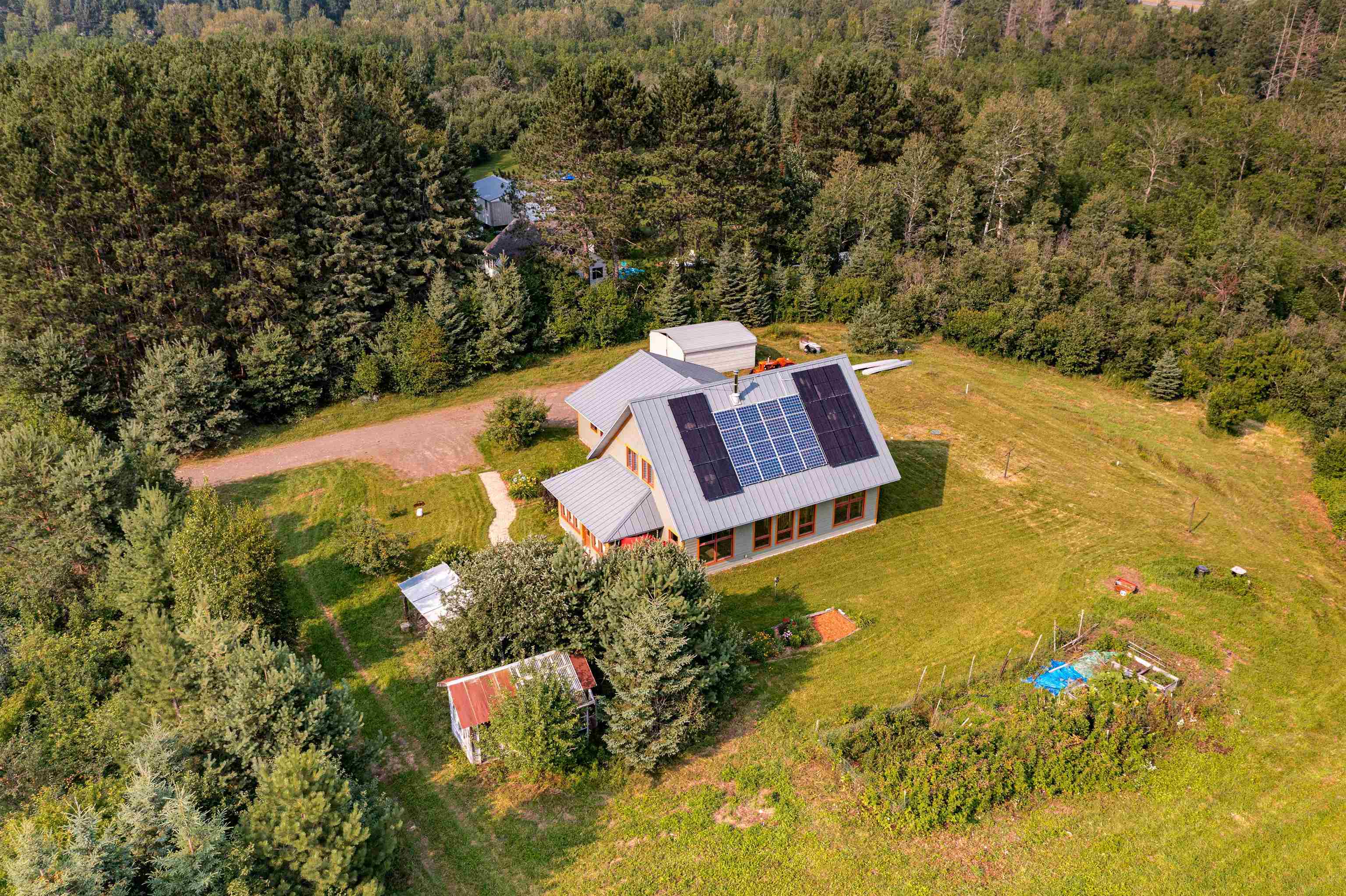 374 Nelson Road Cloquet, MN 55720 - Photo 7 of 33 View of subject property with a heavily wooded area