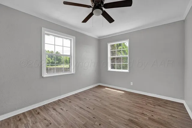 a view of room window and wooden floor