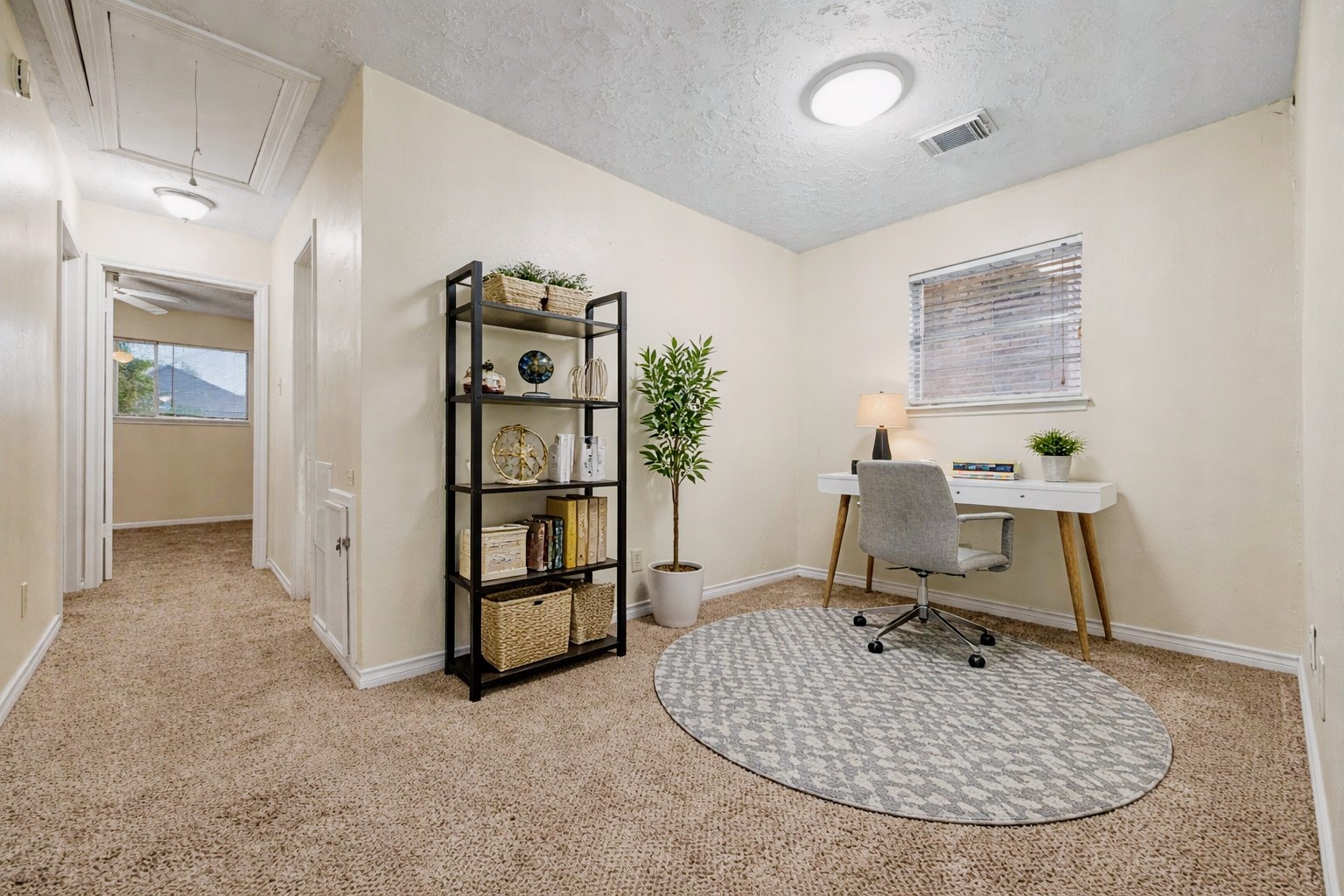 1103 Suwanee Lane Houston, TX 77090 - Photo 12 of 19 This versatile second-floor flex space is ideal for a home office, study area, or cozy reading nook, offering a functional layout that adapts easily to your lifestyle needs. Thoughtful virtual staging highlights how this area can be maximized for everyday living.