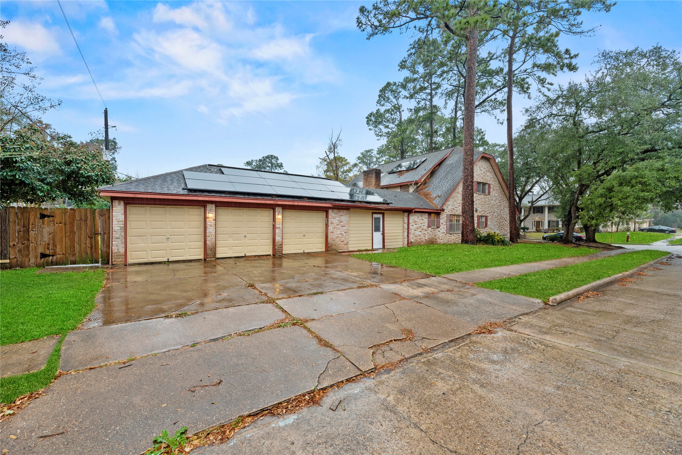 1103 Suwanee Lane Houston, TX 77090 - Photo 18 of 19 This property includes an oversized three-car garage, offering extra room for vehicles, storage, or projects.