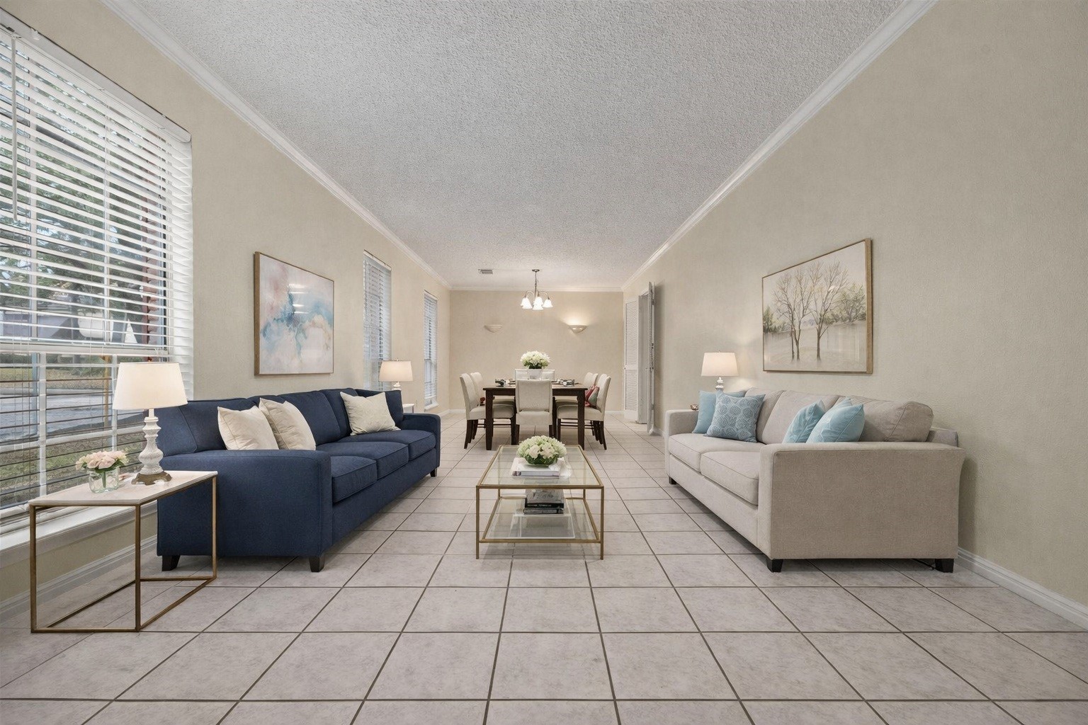 1103 Suwanee Lane Houston, TX 77090 - Photo 2 of 19 Enjoy the formal living room, which includes a large window that brings in outdoor views and natural light. Virtually staged.