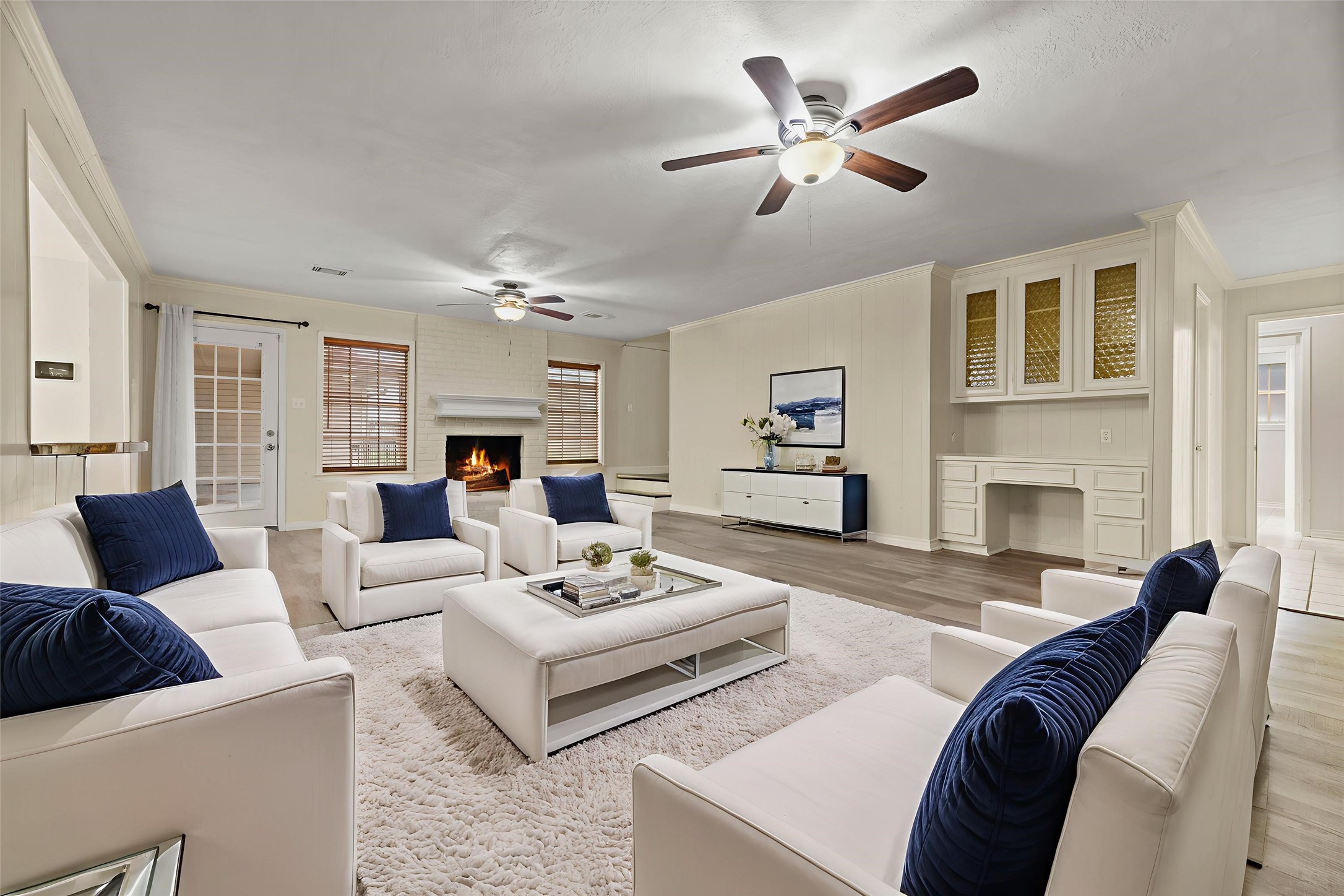 1103 Suwanee Lane Houston, TX 77090 - Photo 3 of 19 The family room offers an additional living space for everyday use, featuring its own fireplace and large windows that bring in natural light. Virtually staged.