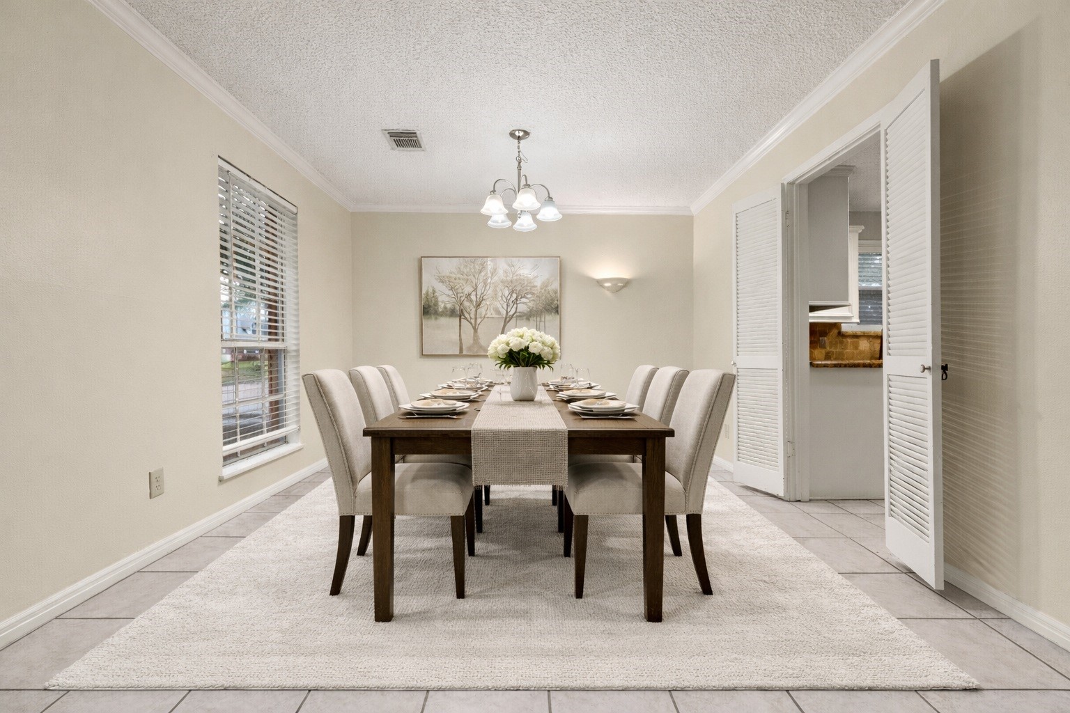1103 Suwanee Lane Houston, TX 77090 - Photo 6 of 19 Imagine gathering for meals in this elegant dining space, highlighted by a chic chandelier that adds warmth and sophistication to every occasion. Virtually staged.