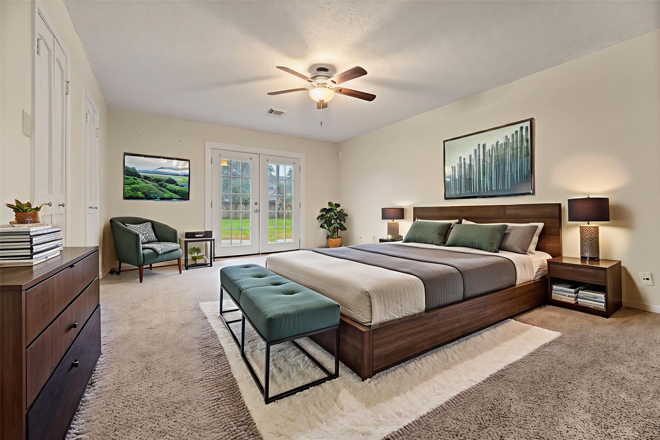 1103 Suwanee Lane Houston, TX 77090 - Photo 9 of 19 The primary bedroom provides a spacious retreat with direct access to the private bath and the backyard, creating an easy flow between indoor and outdoor spaces. Virtually staged.
