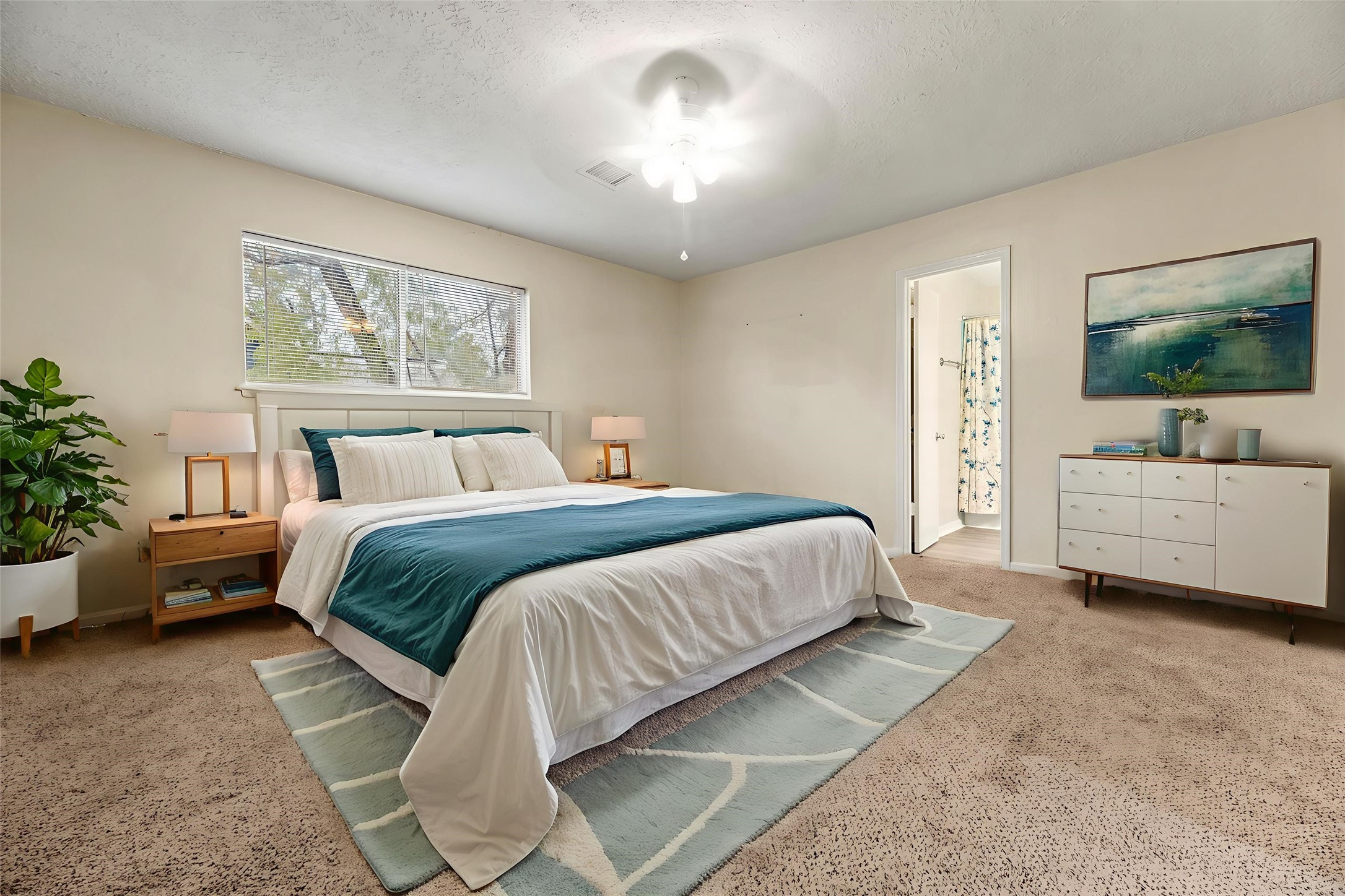 1103 Suwanee Lane Houston, TX 77090 - Photo 10 of 19 This comfortable secondary bedroom offers a bright and inviting space, featuring a beautiful large window. Virtually staged.