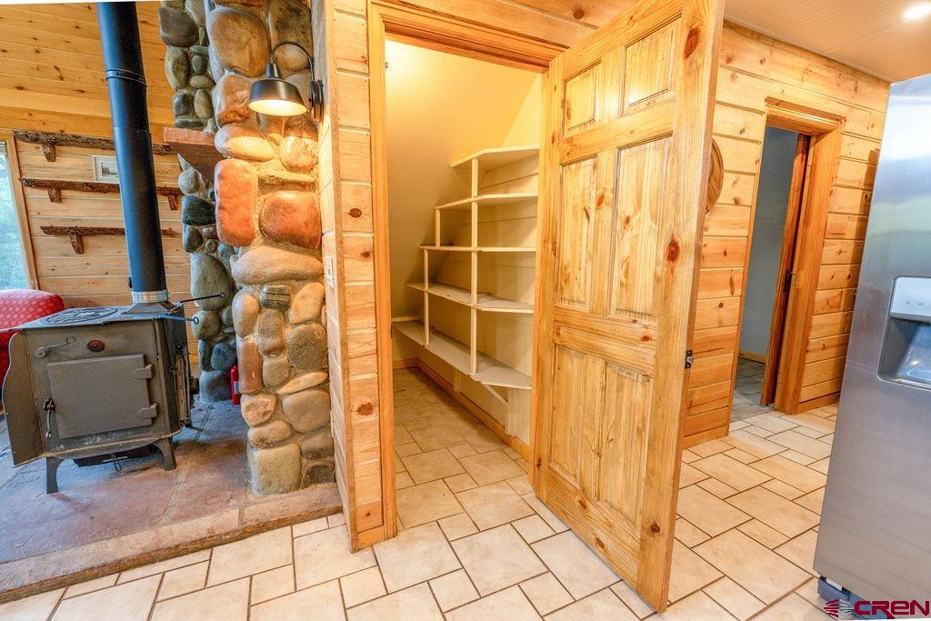 19595 Surface Creek Road Cedaredge, CO 81413 - Photo 18 of 28 a view of a door with wooden walls