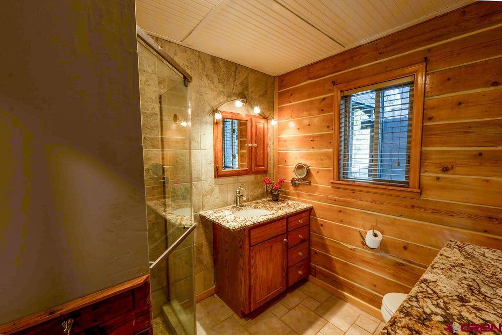 19595 Surface Creek Road Cedaredge, CO 81413 - Photo 7 of 28 a bathroom with a sink and a mirror