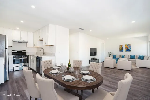 a view of a dining room with furniture and wooden floor