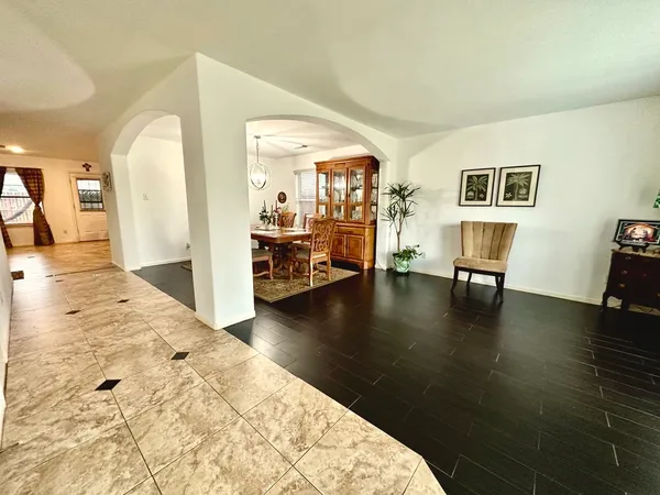 a view of livingroom with furniture wooden floor and windows