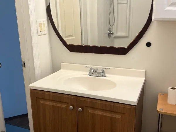 a bathroom with a sink and a mirror