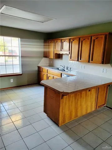 a bathroom with a sink a mirror and a shower