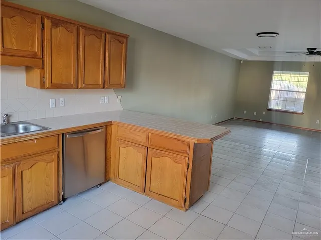 a view of a kitchen with cabinets