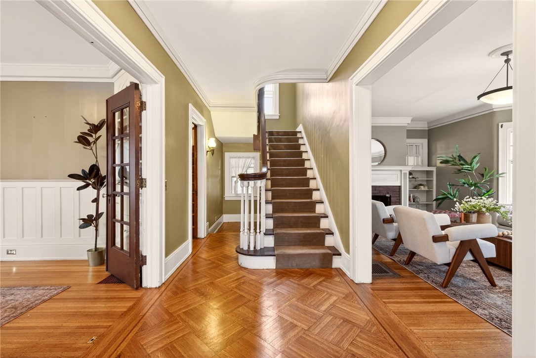 1005 Harvard Street Rochester, NY 14610 - Photo 4 of 50 Step into the grand foyer with original parquet fl