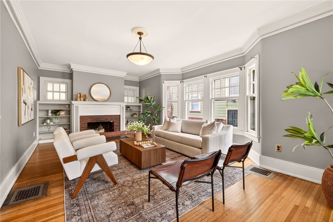 1005 Harvard Street Rochester, NY 14610 - Photo 5 of 50 Living room with wood-burning fireplace