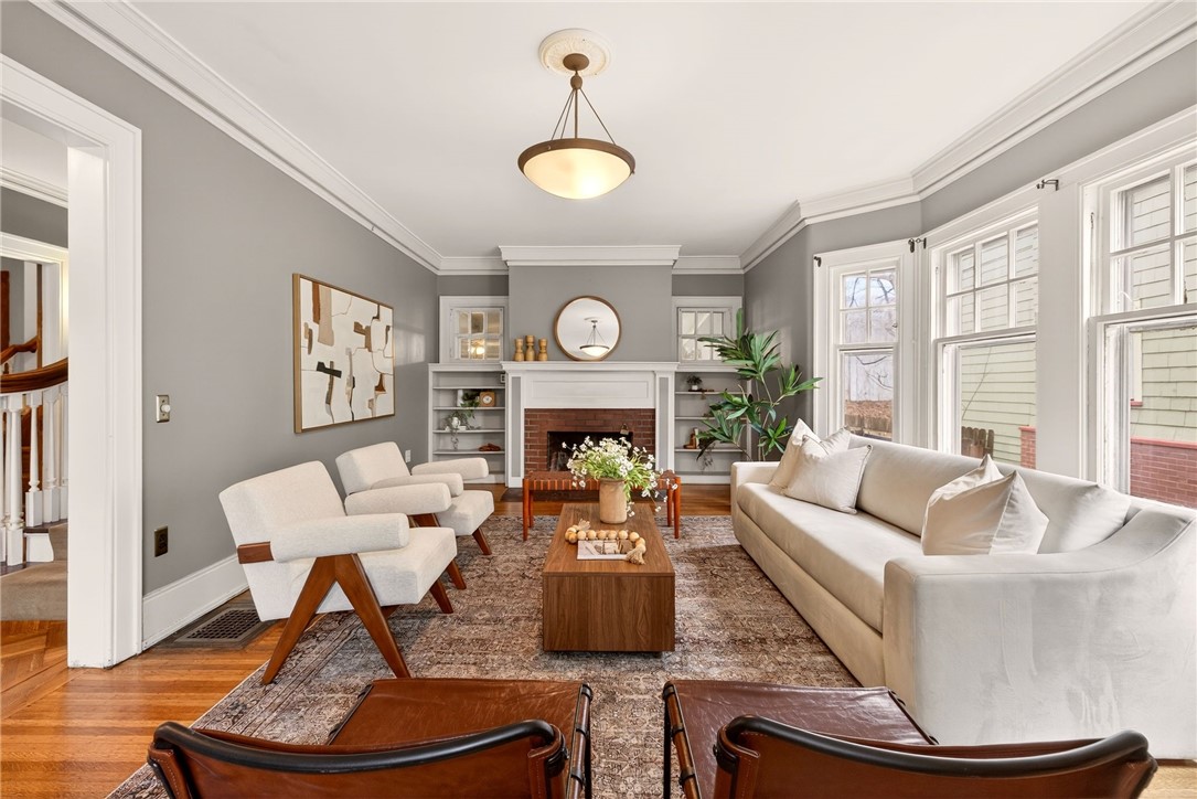 1005 Harvard Street Rochester, NY 14610 - Photo 6 of 50 Living room with wood-burning fireplace