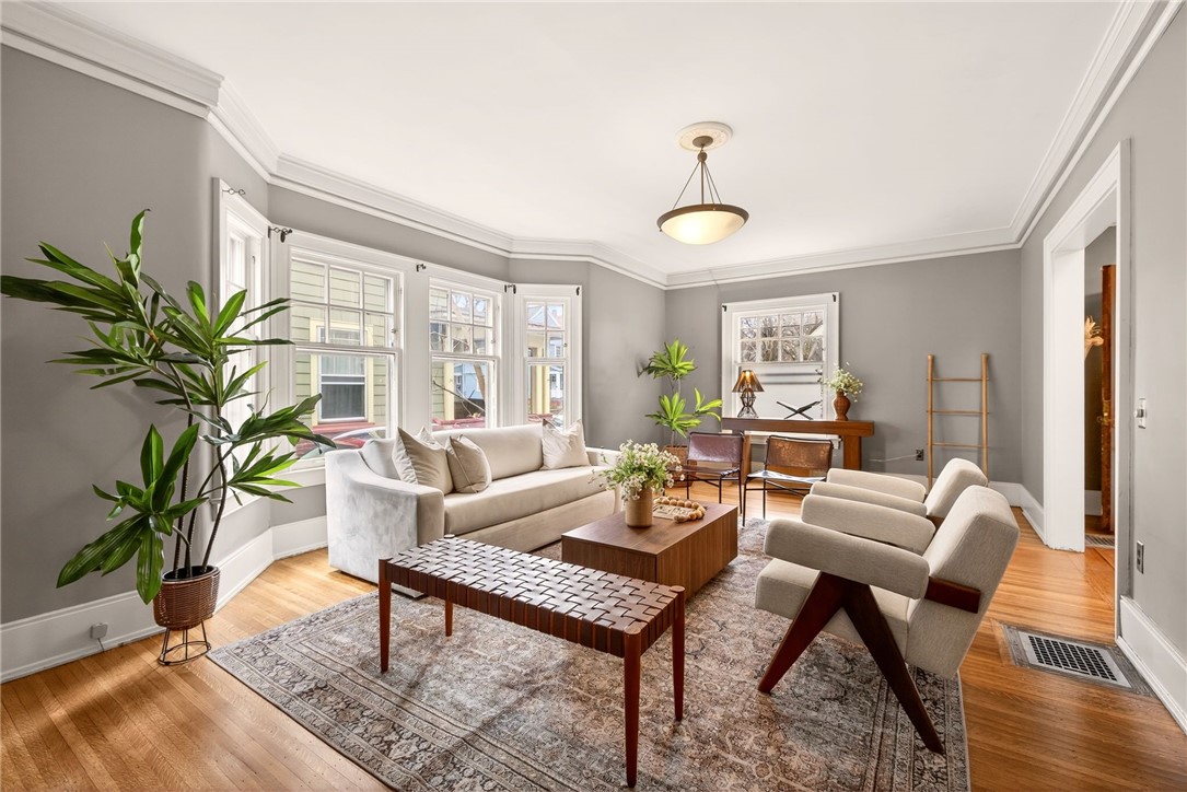 1005 Harvard Street Rochester, NY 14610 - Photo 7 of 50 Living room with wood-burning fireplace