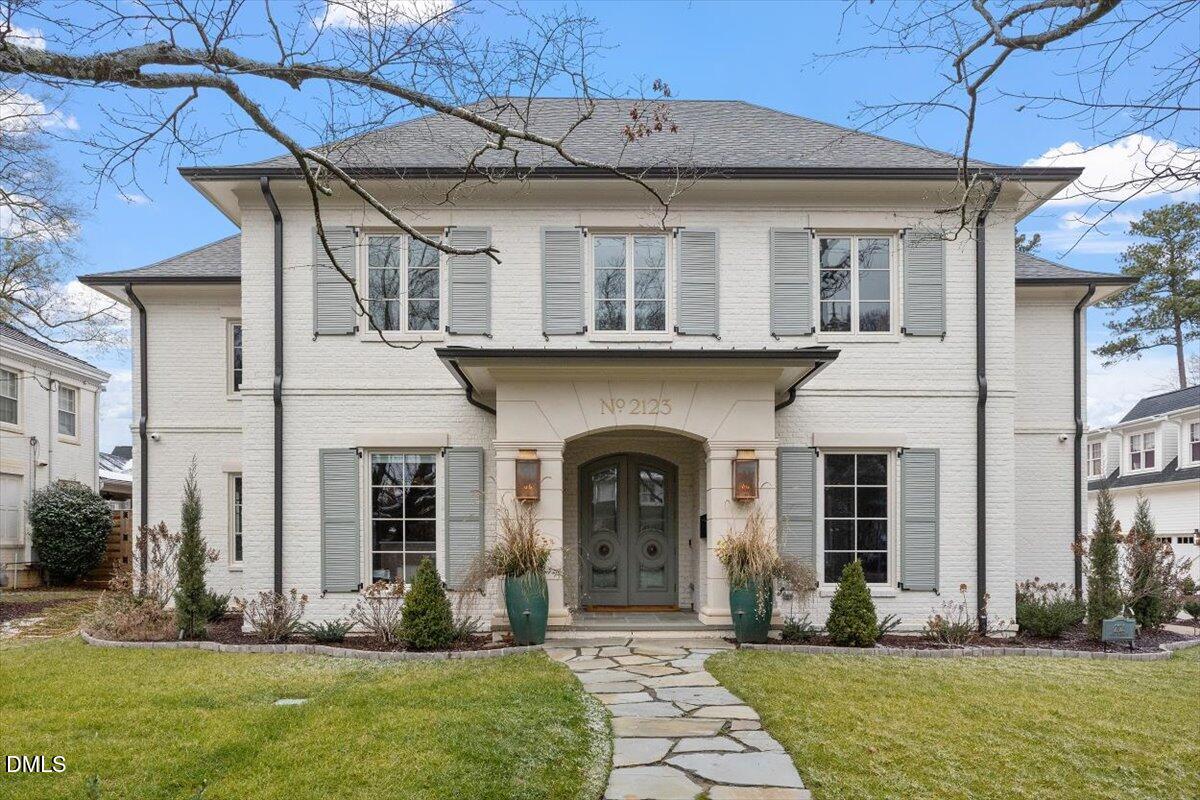 a front view of a house with a yard