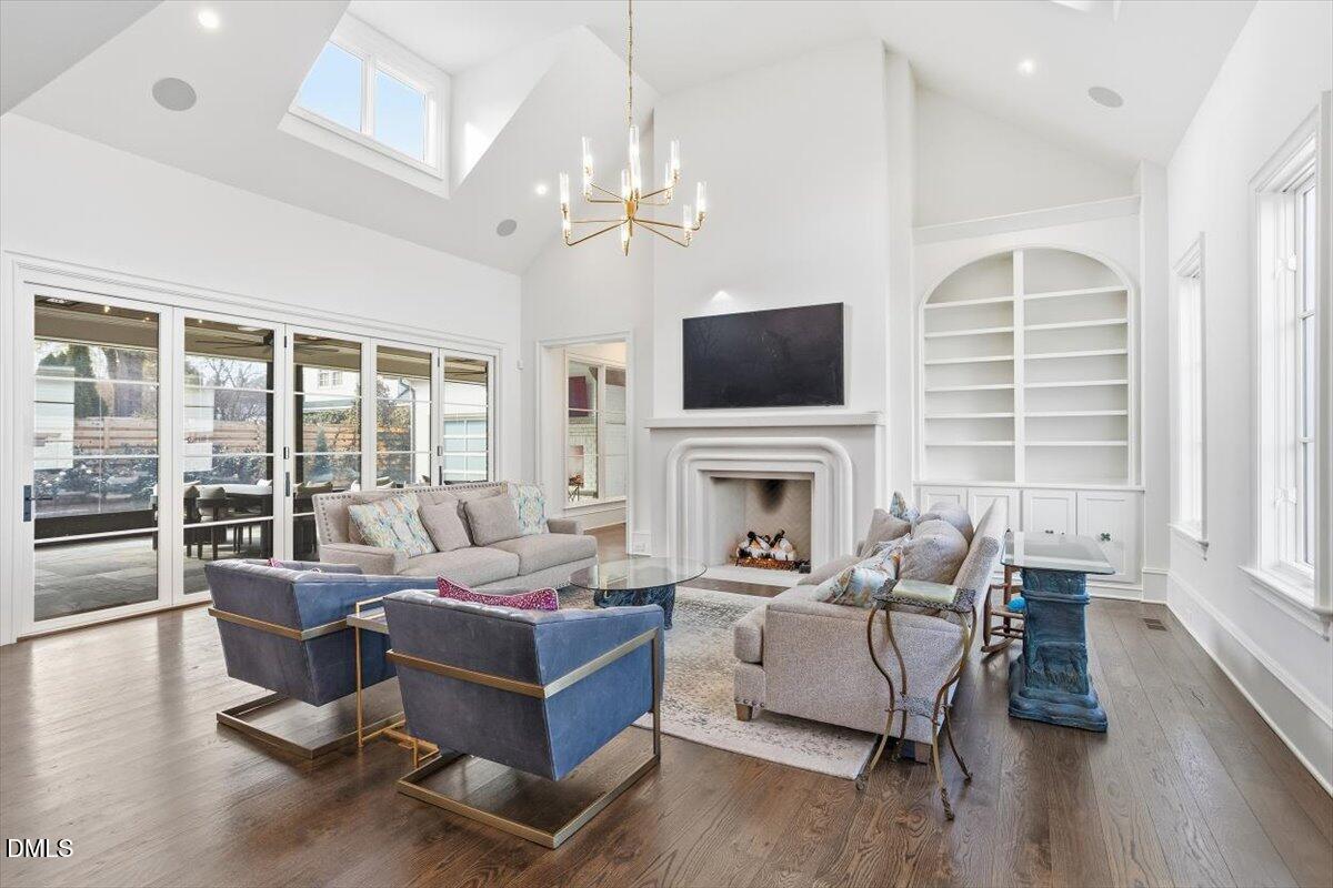 2123 St Marys Street Raleigh, NC 27608 - Photo 15 of 76 a living room with furniture fireplace and flat screen tv