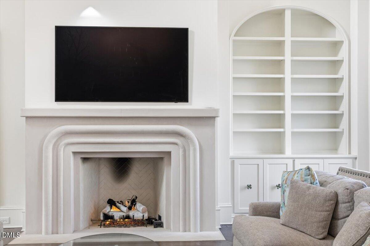 2123 St Marys Street Raleigh, NC 27608 - Photo 16 of 76 a living room with furniture and a fireplace