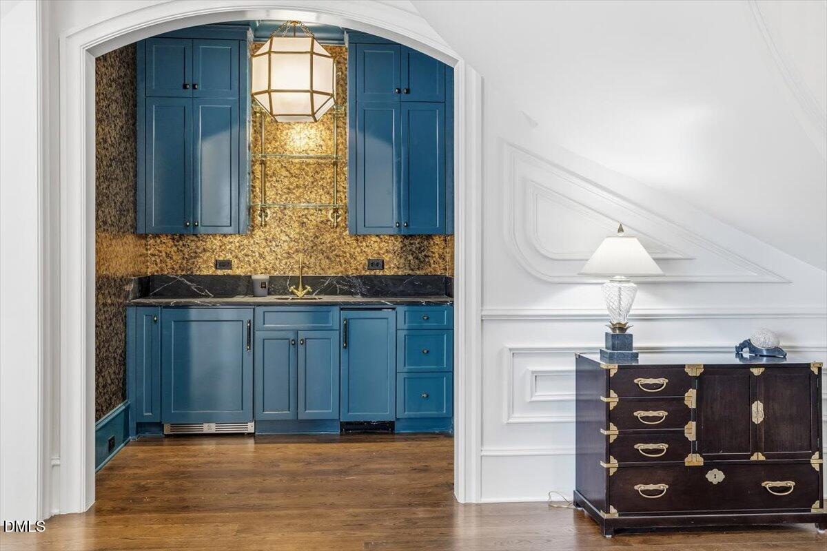 2123 St Marys Street Raleigh, NC 27608 - Photo 23 of 76 a bathroom with a sink a mirror and a vanity