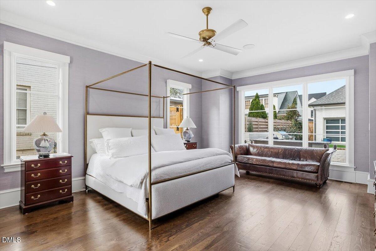 2123 St Marys Street Raleigh, NC 27608 - Photo 25 of 76 a bedroom with a bed and a chandelier