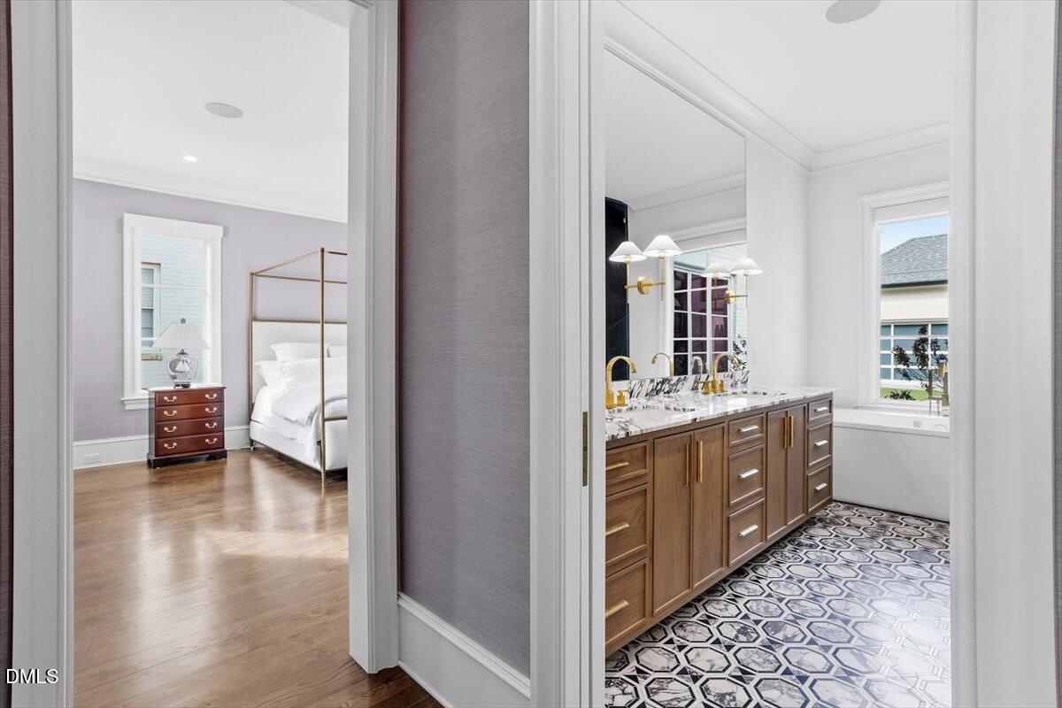 2123 St Marys Street Raleigh, NC 27608 - Photo 27 of 76 a spacious bathroom with a double vanity sink and a mirror