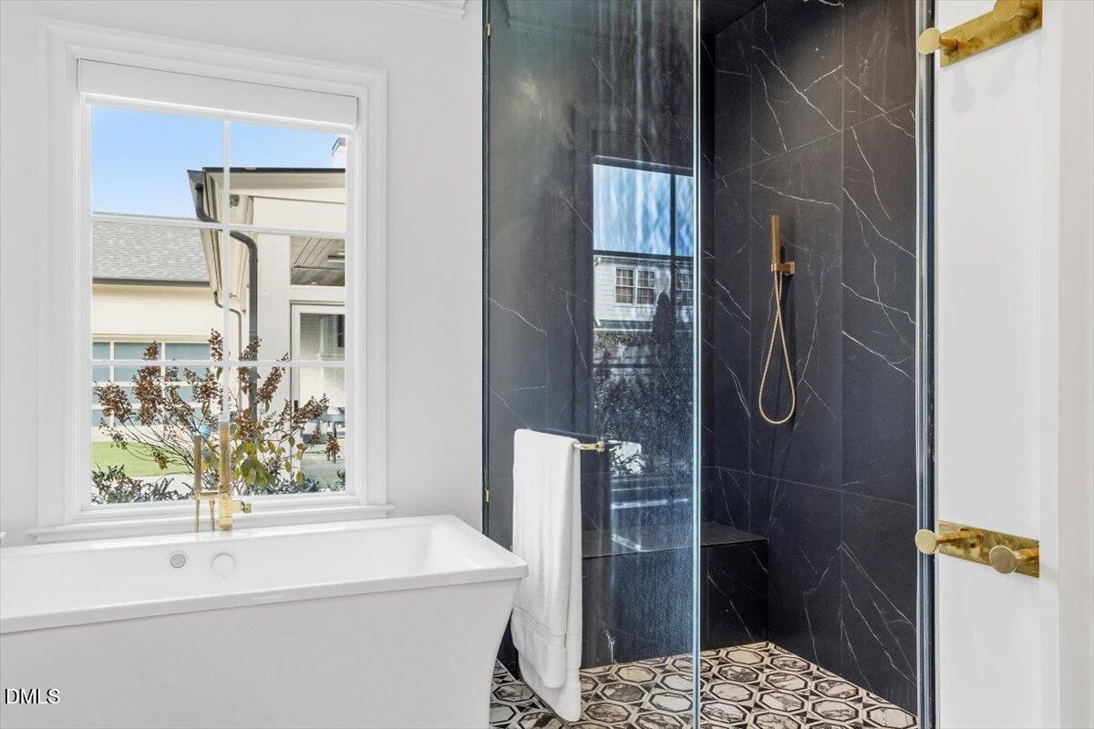2123 St Marys Street Raleigh, NC 27608 - Photo 29 of 76 a bathroom with a sink and a shower