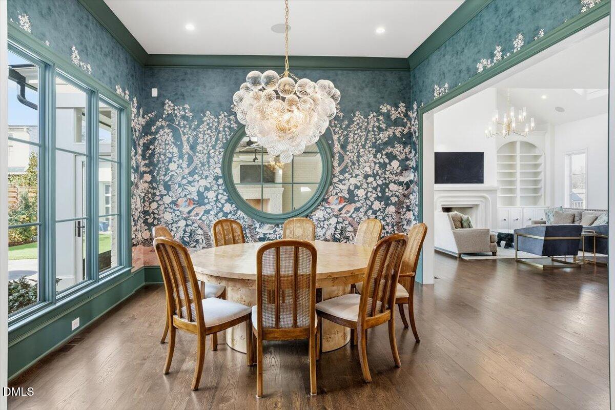 2123 St Marys Street Raleigh, NC 27608 - Photo 3 of 76 a view of a dining room with furniture and chandelier
