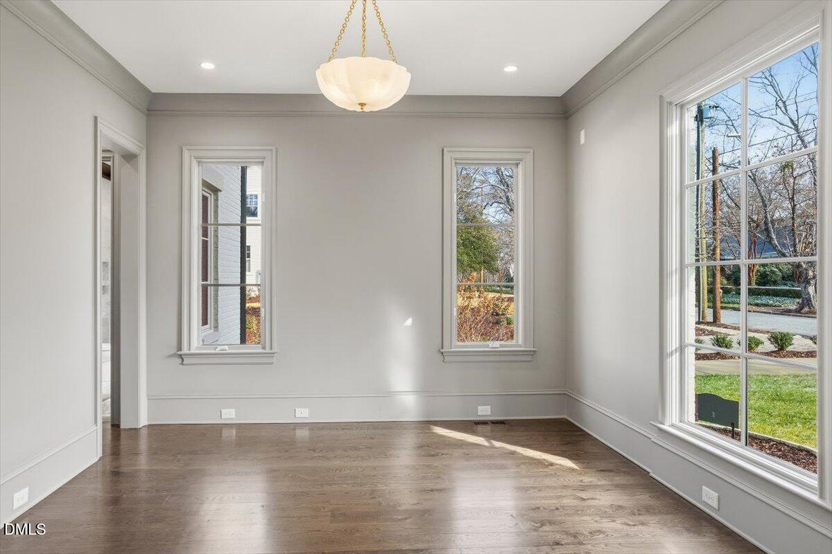 2123 St Marys Street Raleigh, NC 27608 - Photo 33 of 76 an empty room with wooden floor and windows