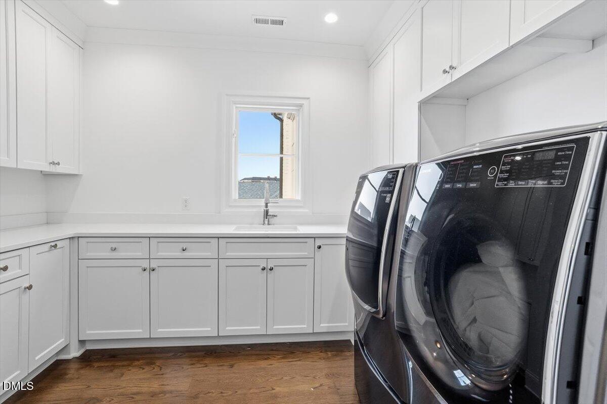 2123 St Marys Street Raleigh, NC 27608 - Photo 49 of 76 a bathroom with a sink and a mirror