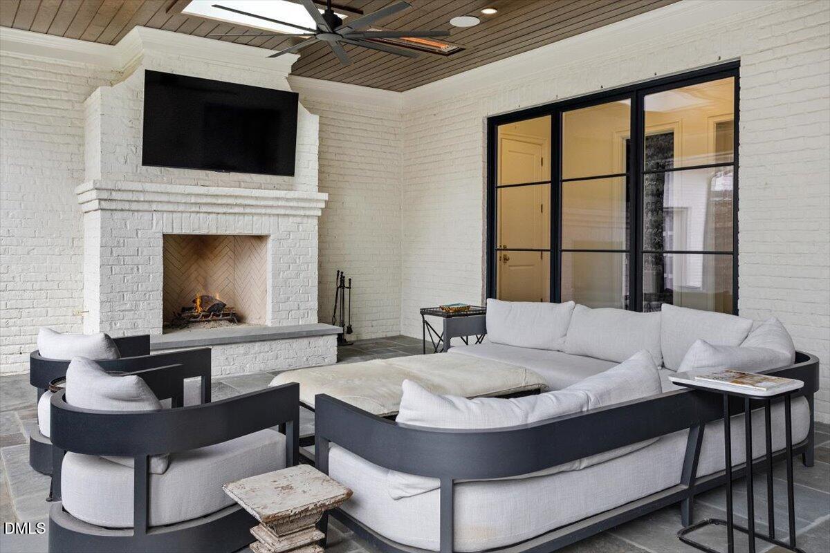 2123 St Marys Street Raleigh, NC 27608 - Photo 54 of 76 a living room with furniture and a fireplace