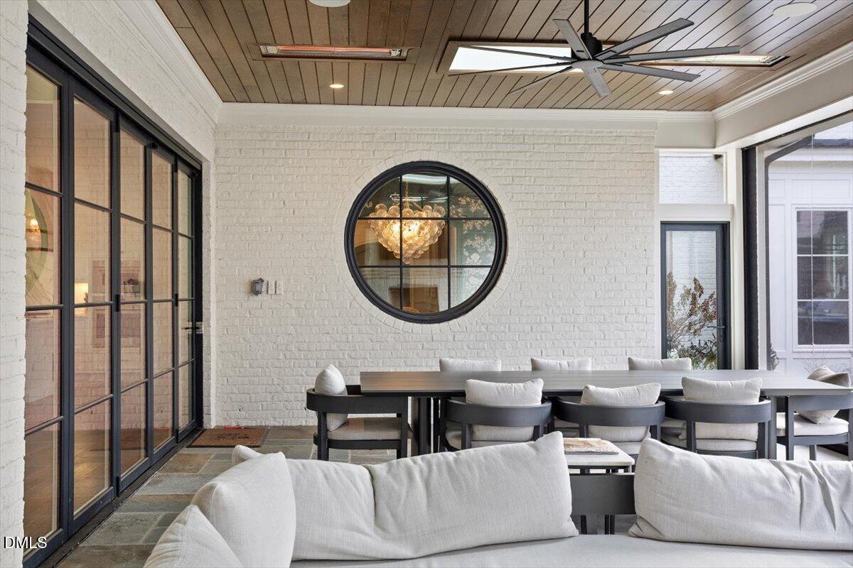 2123 St Marys Street Raleigh, NC 27608 - Photo 56 of 76 a living room with furniture and a large mirror