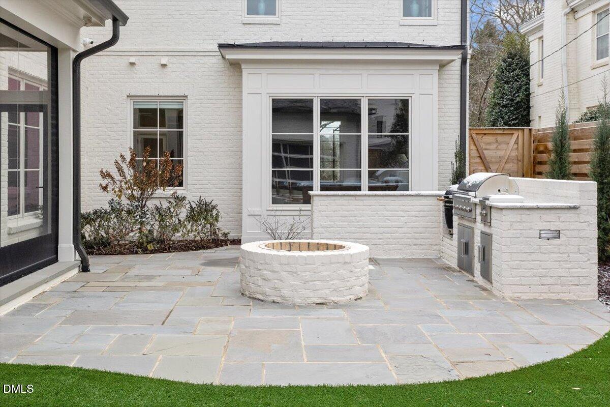 2123 St Marys Street Raleigh, NC 27608 - Photo 61 of 76 a front view of a house with a yard