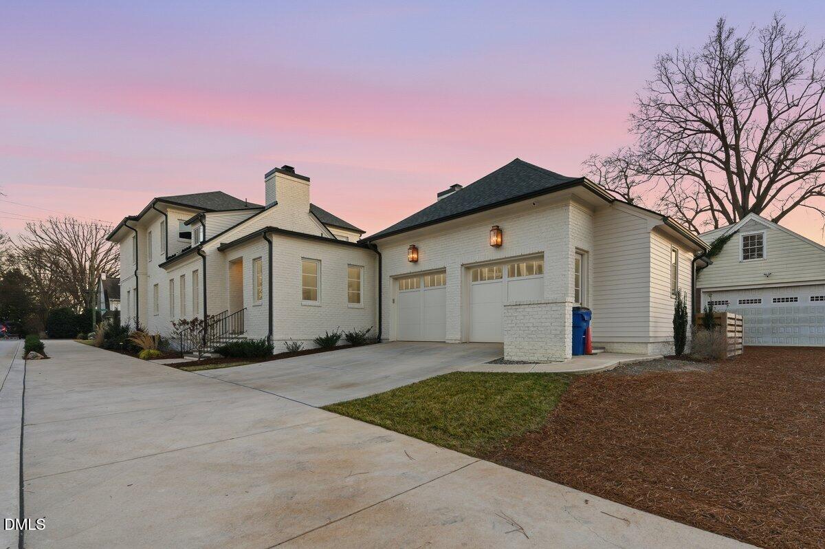 2123 St Marys Street Raleigh, NC 27608 - Photo 69 of 76 a front view of a house with a yard and garage