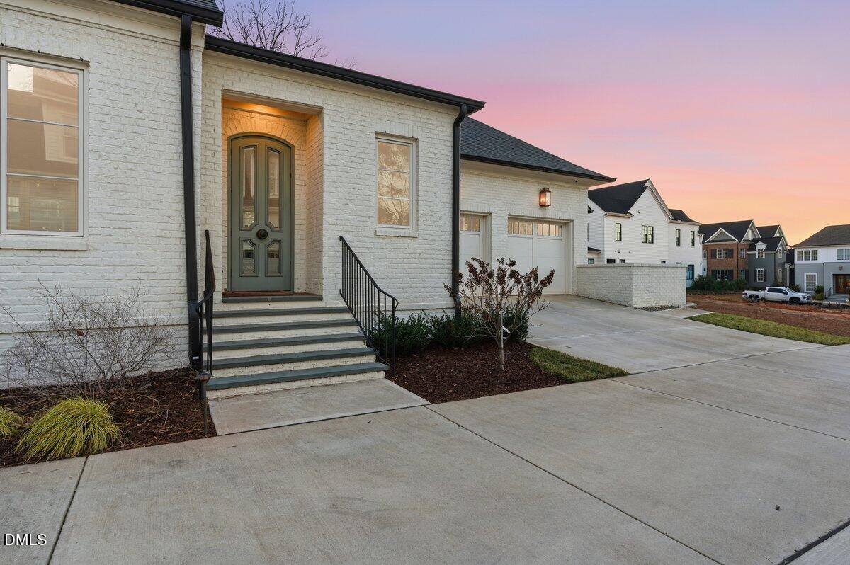 2123 St Marys Street Raleigh, NC 27608 - Photo 71 of 76 a view of a house with backyard and parking area