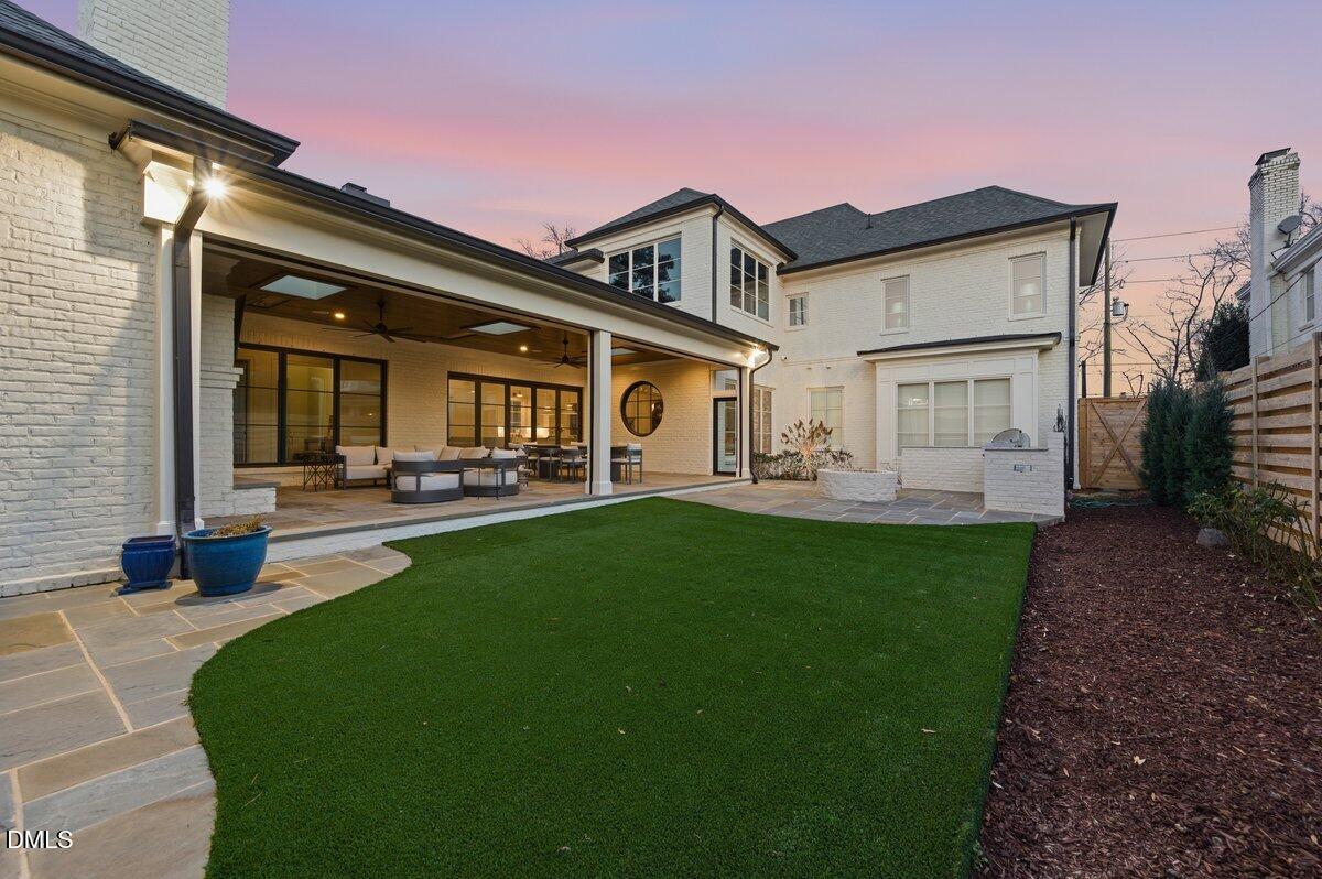 2123 St Marys Street Raleigh, NC 27608 - Photo 74 of 76 a front view of a house with a garden and plants
