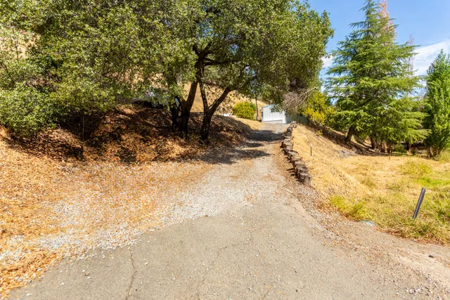 a view of a backyard of the house
