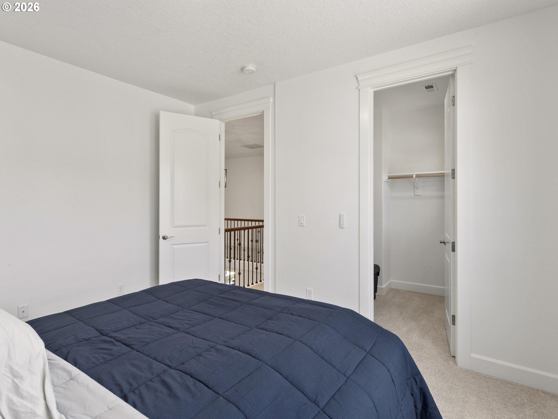 1012 Northwest Goodwin Street Camas, WA 98607 - Photo 32 of 44 a bedroom with a bed and cabinets
