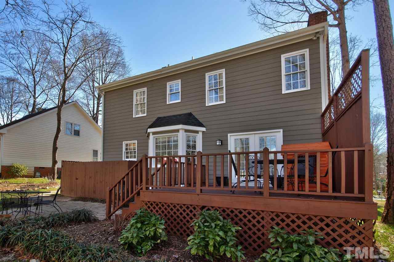 7141 Kinross Drive Raleigh, NC 27613 - Photo 16 of 19 a front view of a house with a yard