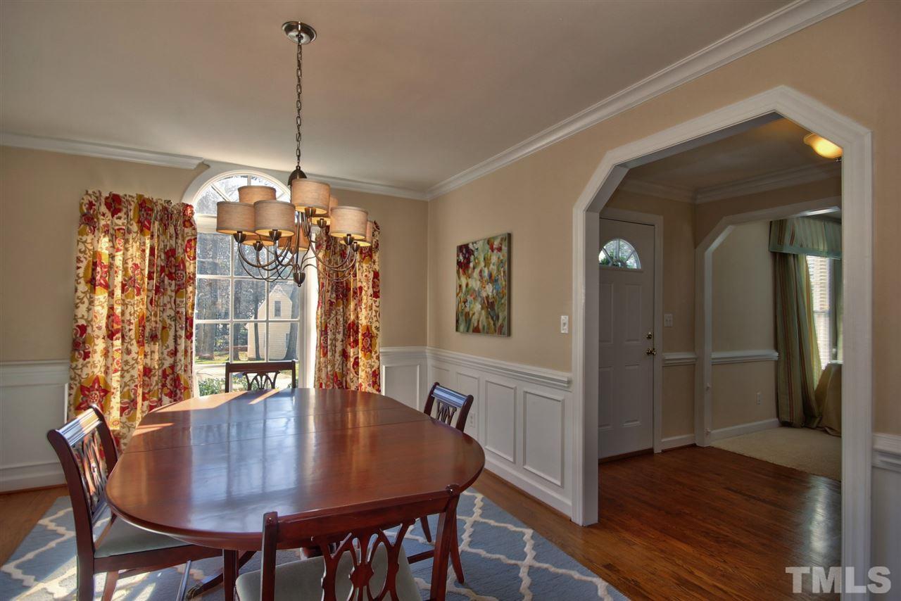 7141 Kinross Drive Raleigh, NC 27613 - Photo 8 of 19 a view of a dining room with furniture and wooden floor