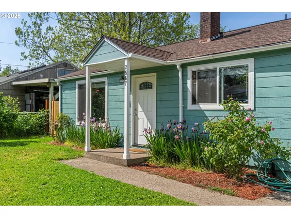 a front view of a house with garden